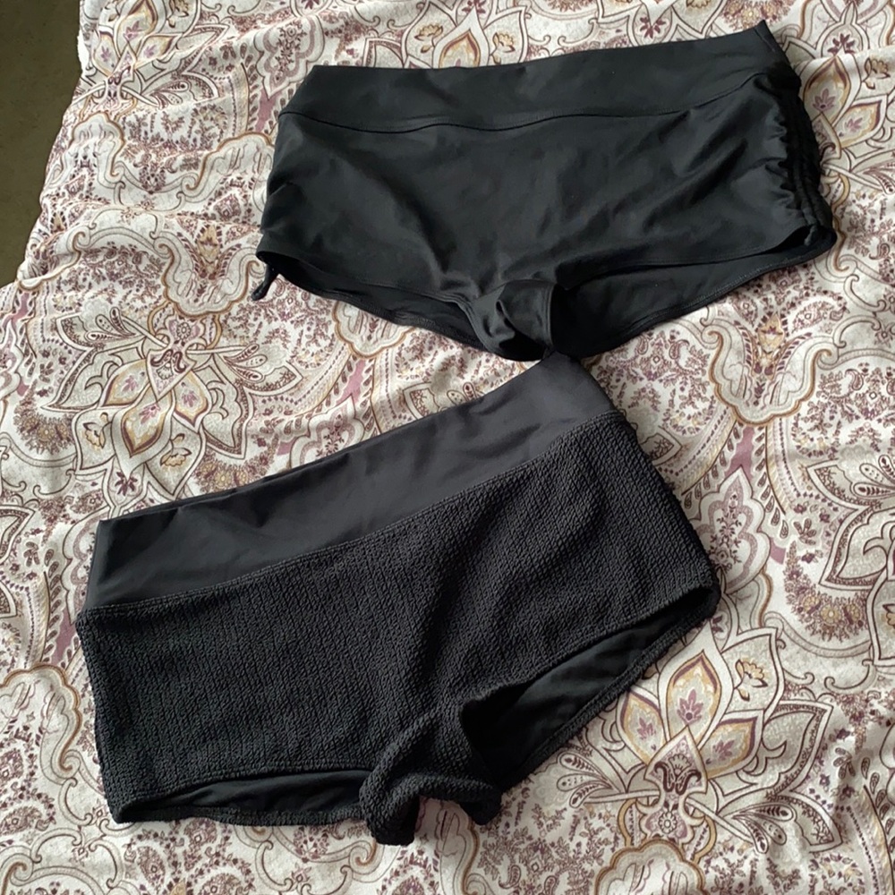 2 black swim shorts. Size Large Pink brand